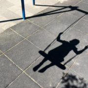 Shadow of a child on a swing